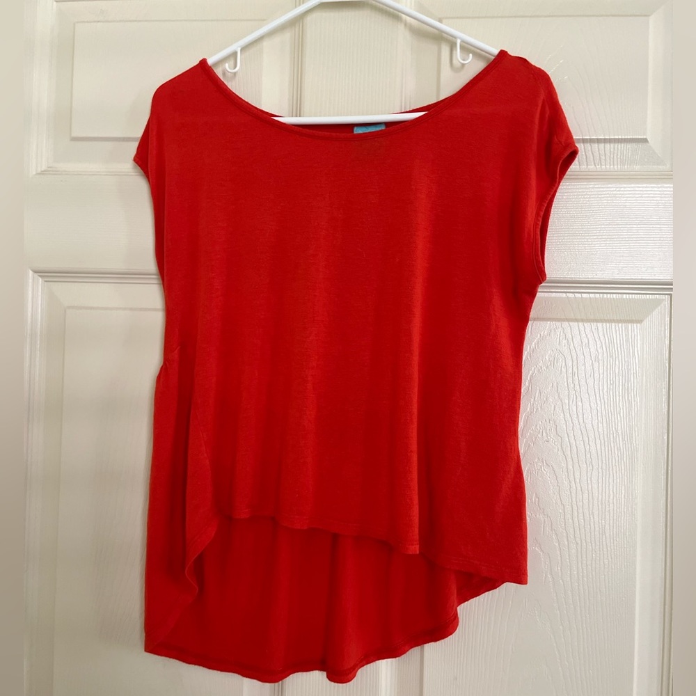 h.I.p. Orange top with a flare lower back
